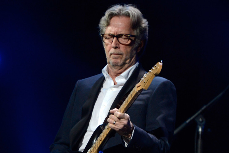 NEW YORK, NY - DECEMBER 12:  Eric Clapton performs at "12-12-12" a concert benefiting The Robin Hood Relief Fund to aid the victims of Hurricane Sandy presented by Clear Channel Media & Entertainment, The Madison Square Garden Company and The Weinstein Company at Madison Square Garden on December 12, 2012 in New York City.  (Photo by Kevin Mazur/WireImage for Clear Channel)